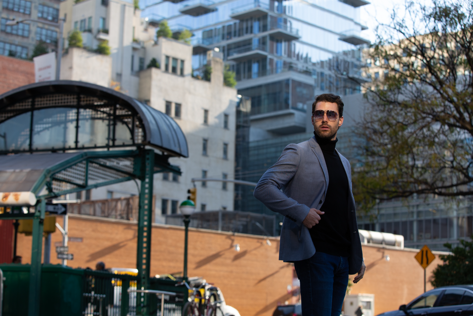 Model wearing designer aviator sunglasses on a New York City street
