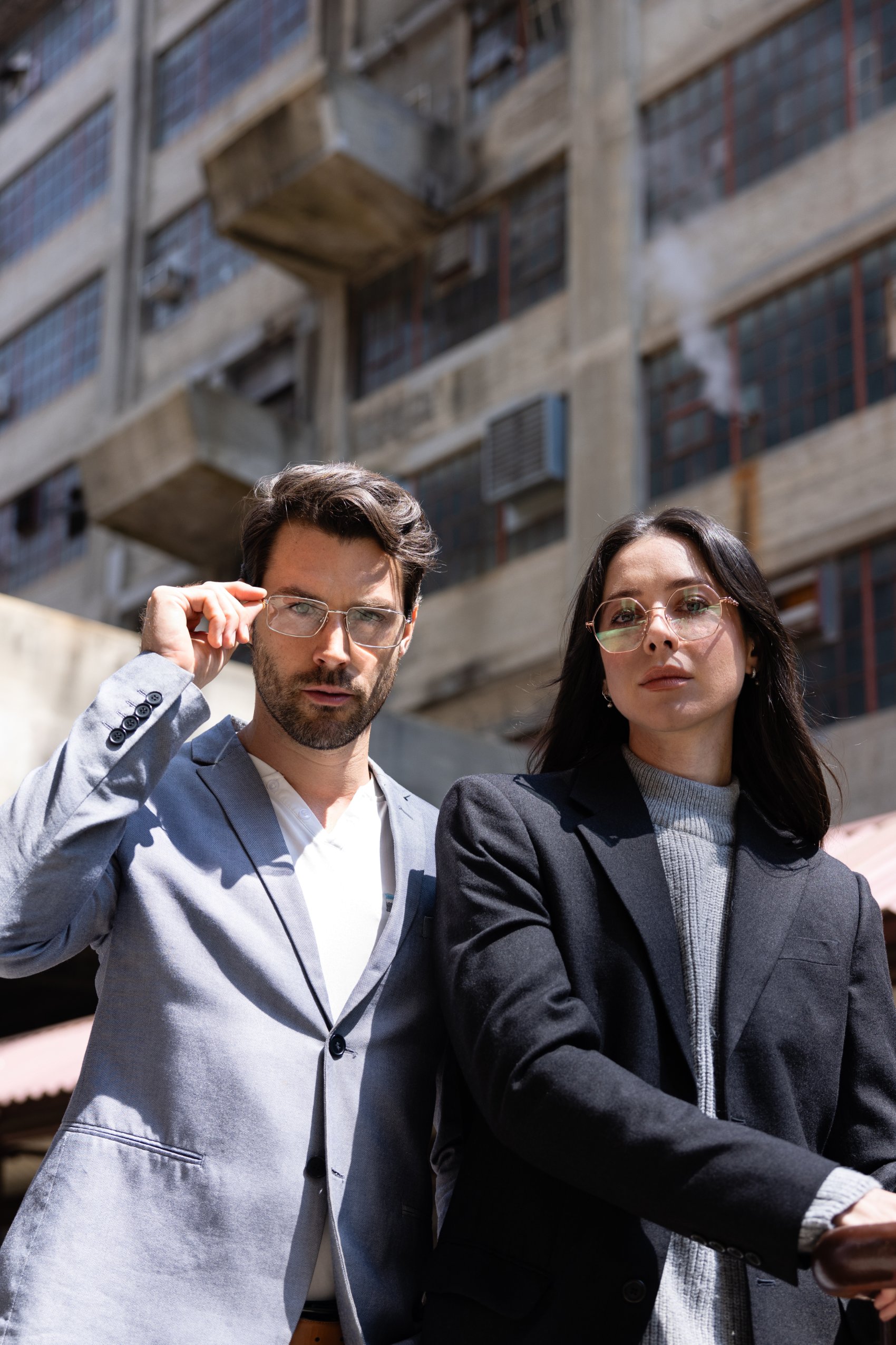 Two retail buyers wearing premium designer optical frames