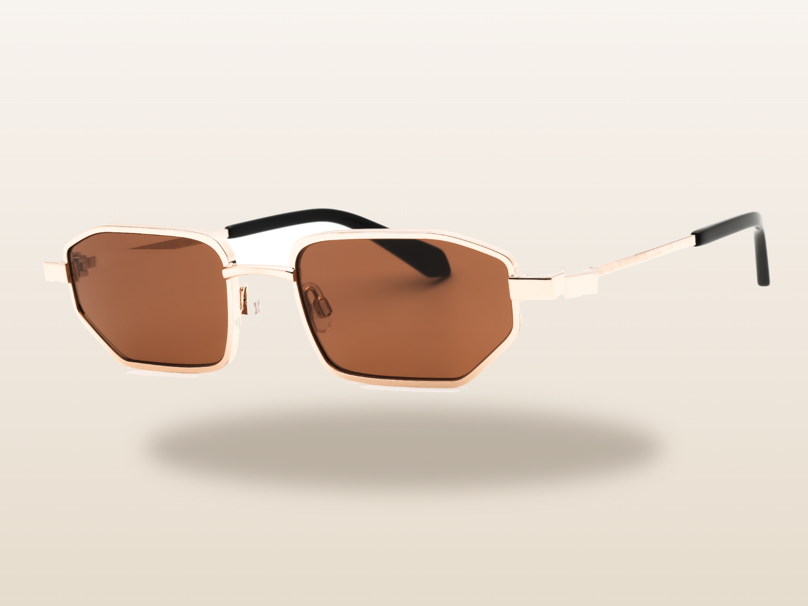 Brown-lens gold hexagonal sunglasses for travel and resort wear